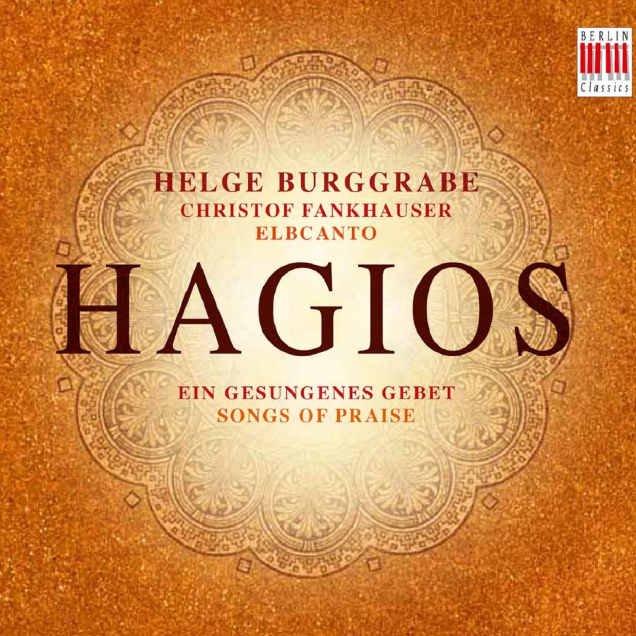 Grafisches Cover vom Album Hagios (Songs of Praise) von Helge Burggrabe. Der Hintergrund ist orange und Mandala ähnlich, symmetrisch gemustert. Der Titel steht zentriert in der Mitte in braunroter Schrift
