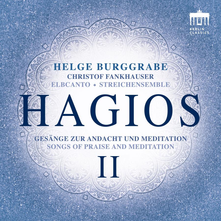 Grafisches Cover vom Album Hagios II (Songs of Praise and Meditation) von Helge Burggrabe. Der Hintergrund ist blau und Mandala ähnliche, symmetrisch gemustert, drüber ist zentriert der Titel in blauer Schrift platziert